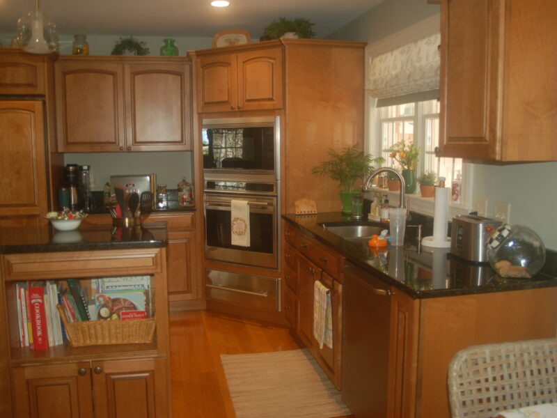 Houseplants and appliances add charm to this renovated kitchen – McPhee Associates of Cape Cod.
