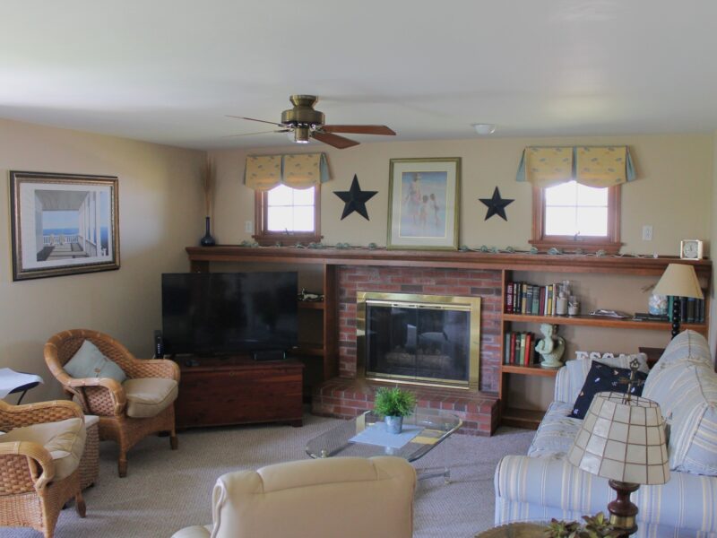 Before photo of the living room of a 1970s colonial in Dennis before it was remodeled.